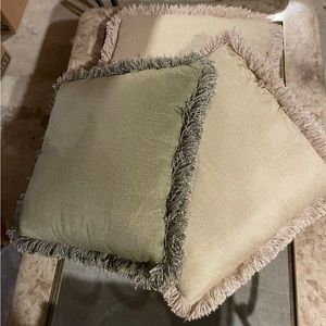 Set of three fringed pillows